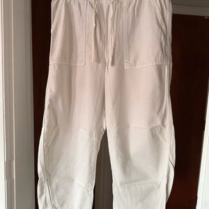 Women pull on barrel pants